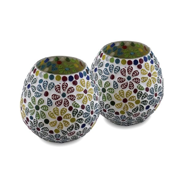 Colorful mosaic glass candle holders with tealights lit inside
