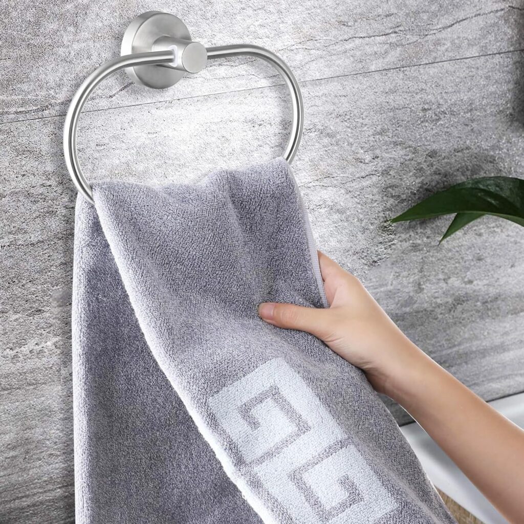 Wall-mounted towel rod and adhesive towel ring for bathroom organization under ₹1000.