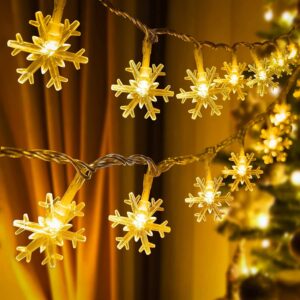 Desidiya warm white snowflake-shaped Christmas string lights hanging decoratively.