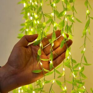 The Purple Tree artificial vine leaf curtain with 200 warm LED lights arranged in a decorative hanging pattern.
